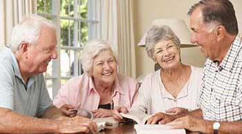 Residents laughing while reading books